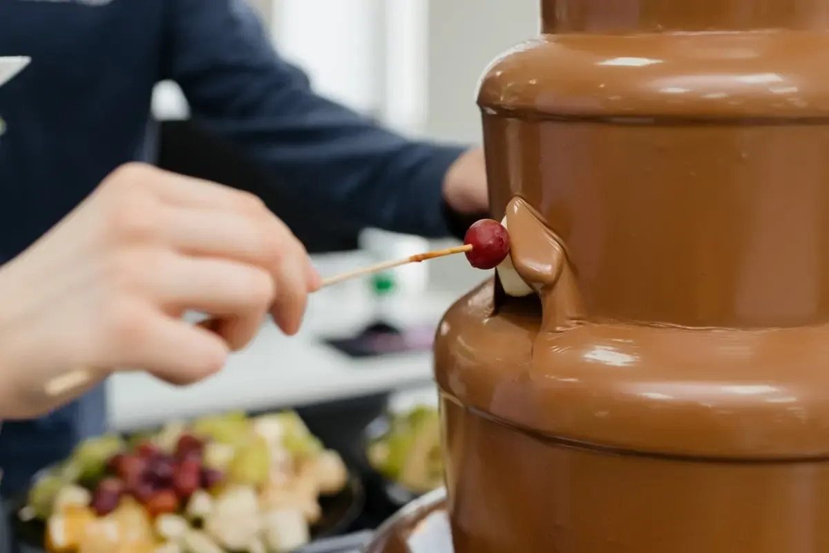 Chocolate fountain running at an evening reception