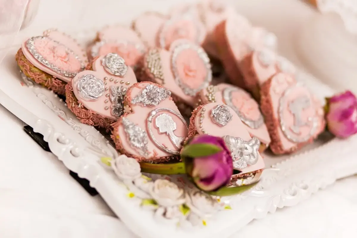 Wedding dessert table with iced cookies and sweets