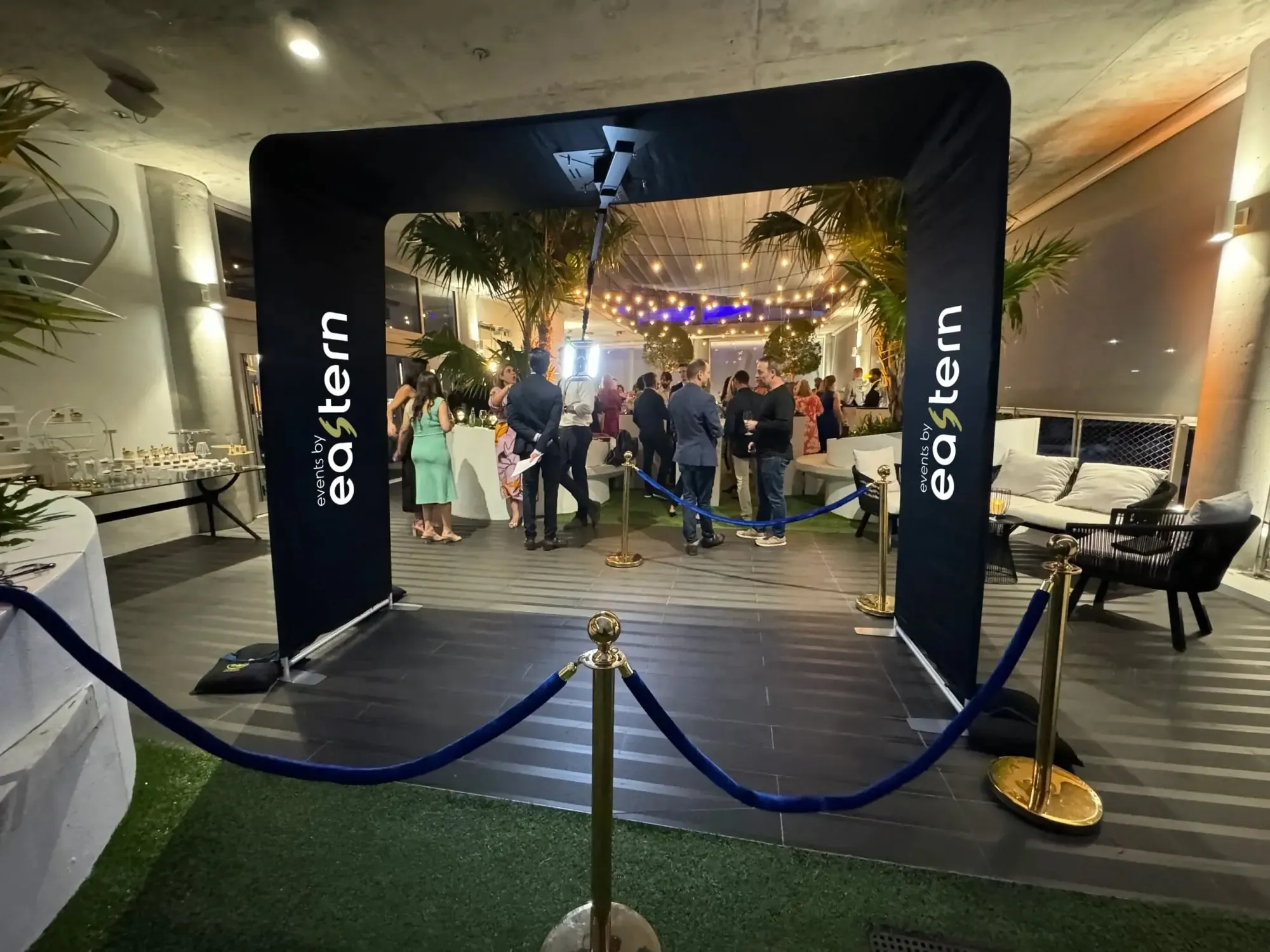 Guests celebrating under warm event lighting